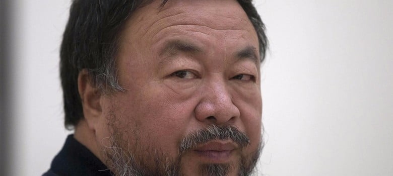 Why did Ai Wei Wei risk public outrage by posing as the iconic drowned child on a pebbled beach?